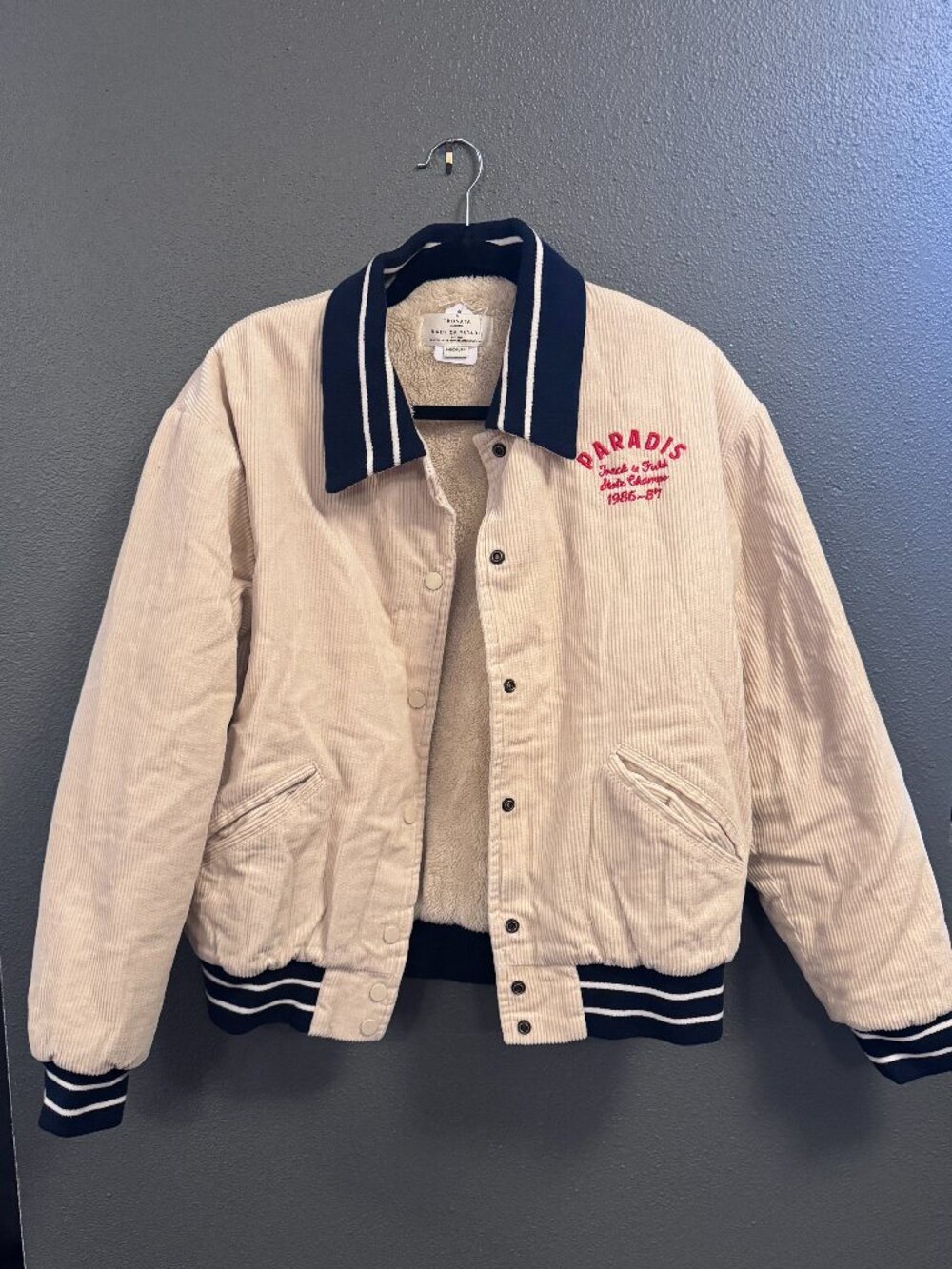 Paradise by Trovata corduroy varsity bomber jacket in cream/oat.